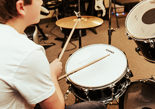 Boy playing drums