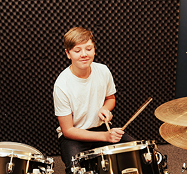 Boy playing drums