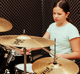 Girl playing drums
