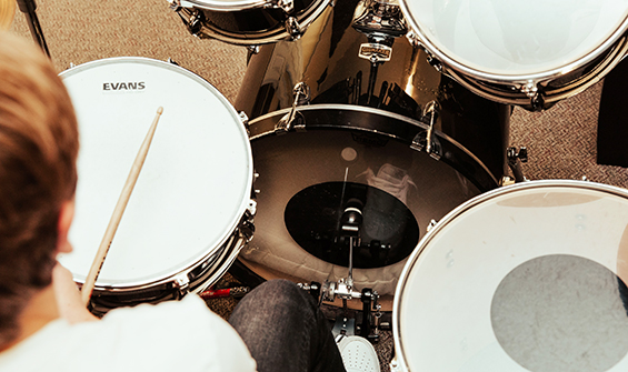 Boy sitting behind a drum set