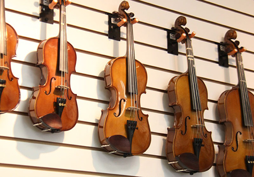 Violins hanging on a wall